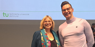 The picture shows the award winner with his doctoral supervisor